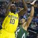 Michigan sophomore Tim Hardaway Jr. looks to shoot the ball around Ohio University junior Walter Offutt during the first half of the second round of the NCAA tournament at Bridgestone Arena in Nashville, Tenn.  Melanie Maxwell I AnnArbor.com